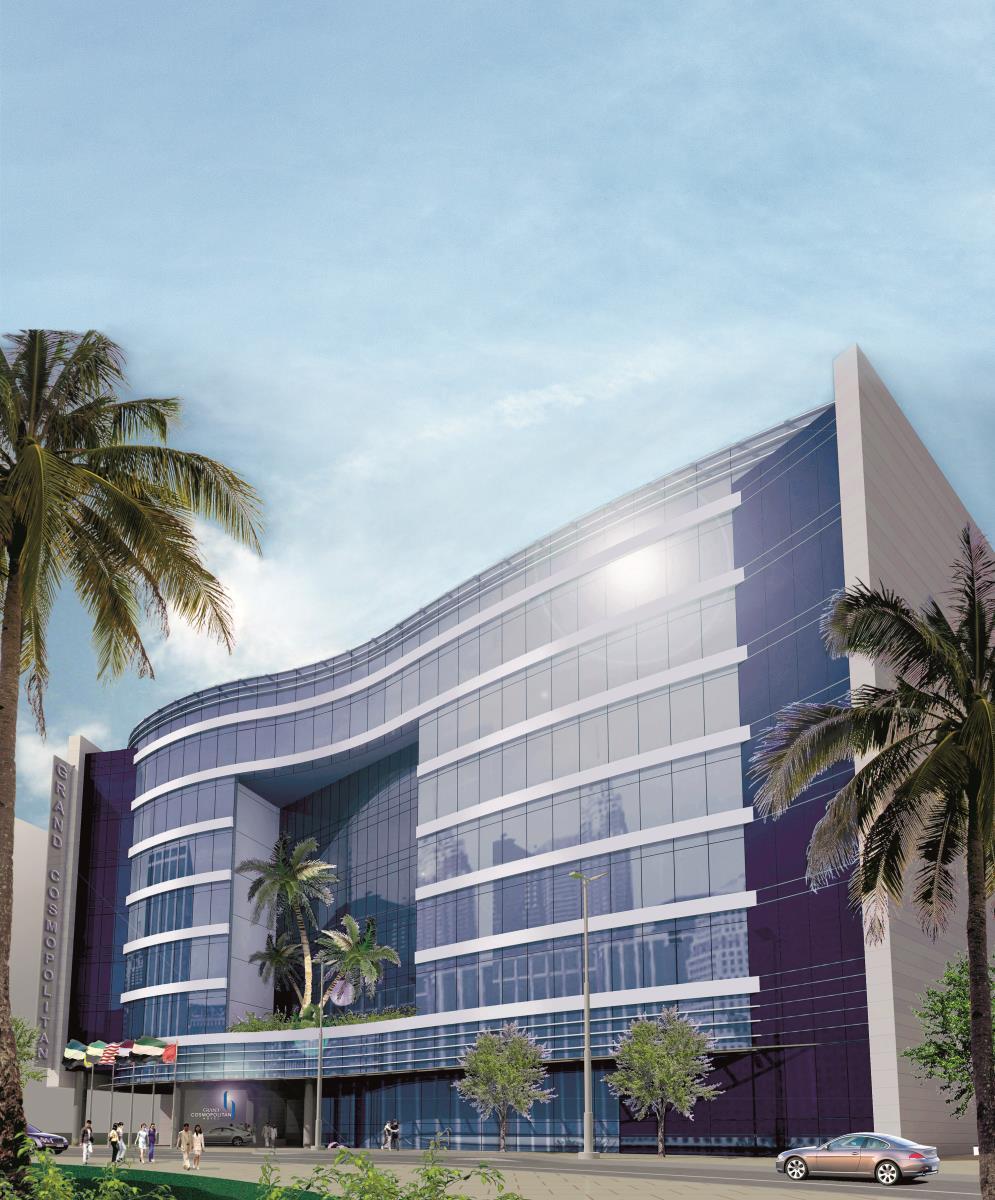 โรงแรมแกรนด์ คอสโมโพลิตัน - ดูไบ ภายนอก รูปภาพ The photo showcases a modern, architectural building characterized by its sleek, curved design and large glass panels. The building features a foreground with palm trees, suggesting a tropical or warm climate. The sky above is clear, adding to the br